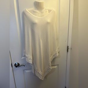 White knit poncho with sheer edge